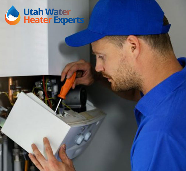 Technician Fixing Water Heater with Screw Driver